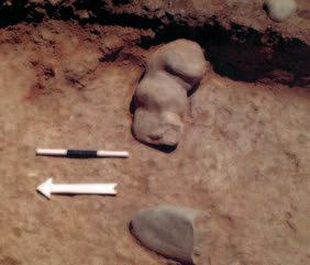1 2 in situ phallomorphic sculpture found near hearth.