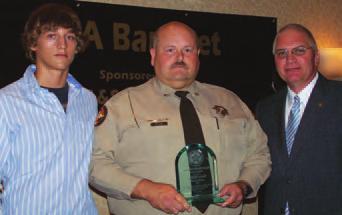 Hall County Sheriff Steve Cronic, pictured at right with Deputy Smith, said she selflessly put herself in harm s way in order to save the life of another person.
