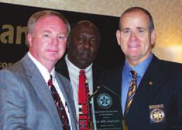 Hall County Sheriff Steve Cronic, left, receives the 2010 President s Award from GSA President, McDuffie County Sheriff Logan Marshall.