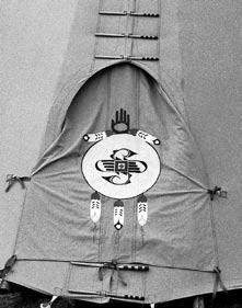 The photographs here demonstrate how the door cover looks from the outside and inside of the tipi.