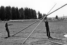 allowing the tripod to sit on the ground. The tripod is now stable and you can begin moving each pole out to its correct position according to the ground plan.