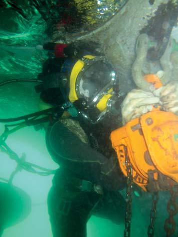 The diver-technician team worked around the