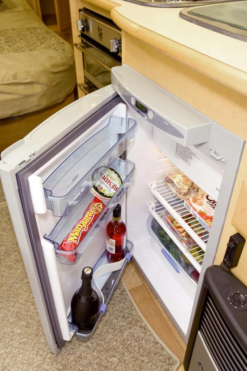 Fresh produce straight from the large 115ltr Thetford fridge is prepared on the worktop -made extra spacious by virtually indestructible heat resistant Chinchilla glass