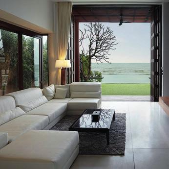 Inside is a vision of elegance, with minimal furniture, gray-scale colors and abundant natural stone.