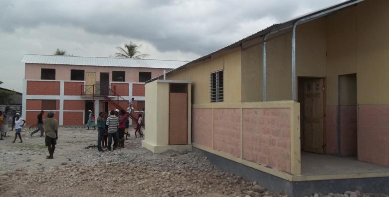 A housing solution: Pilot initiative in Les Cayes One two-story building of 8 family units, and 14 single-story buildings of 2 family units were provided on the site.