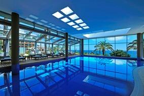With more than 1100 sq metres of indoor and outdoor swimming areas, an infinity pool, a lap