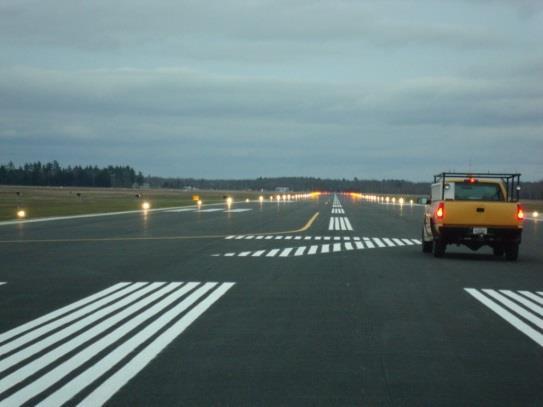 Runways may have other markings besides the end number on them. They may have white stripes down the middle of them, and solid white lines on the edges.