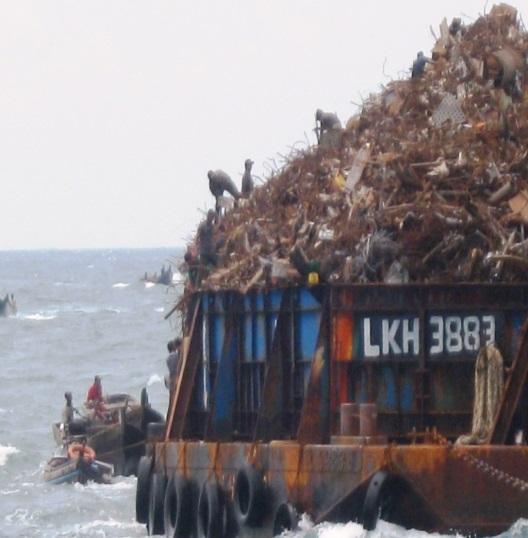 (Photograph courtesy of shipping company) Barges carrying cargo (such as scrap metal) targeted