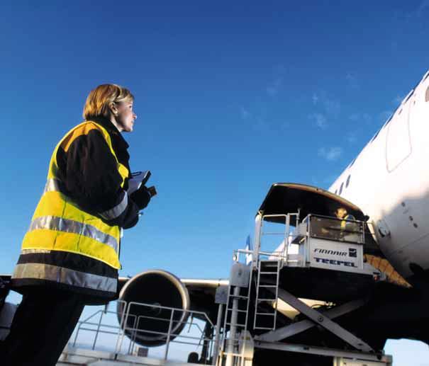 Cargo Ramp Supervisor Benita Lindström oversees the loading of a cargo container on to an Asian flight.