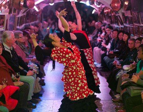 woman moves her hands sinuously while she dances "flamenco".