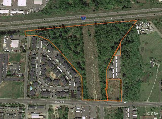unit apartment site. 1 units are built and leased. 82 units are permit ready. Across from Lake Tapps and next to a park and boat launch.