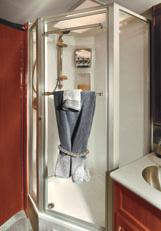 THE ELEGANT GLASS ENCLOSED SHOWER WITH SKYLIGHT features a deluxe adjustable showerhead, a dispenser for bodywash,