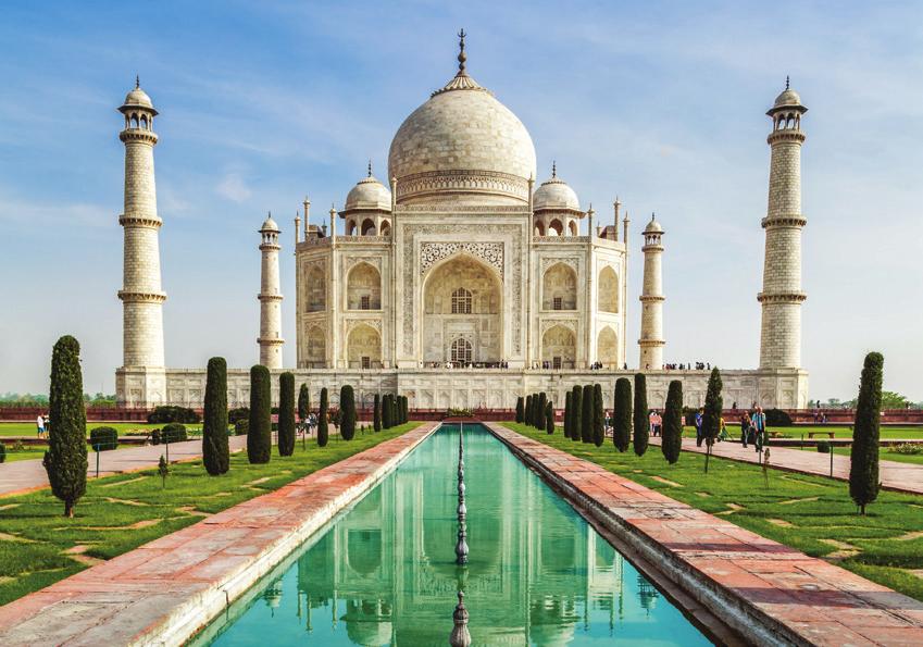 The Taj Mahal is an architectural masterpiece. One of the Seven Wonders of the World, it stands on the banks of the Yamuna River in Agra, India and attracts millions of tourists each year.