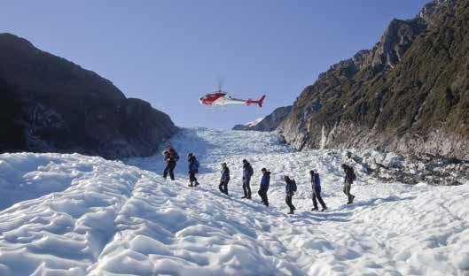 Departing from Fox Glacier, circle the upper icefall before landing on a remote part of a glacier.