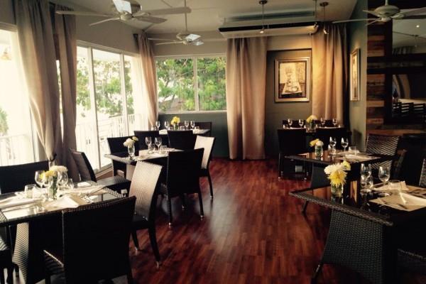 RISTORANTE PRIMA AT THE PALMS RESTAURANT You have the choice of dining in complimentary private cabanas on the sand, the newly renovated air conditioned second floor overlooking Seven Mile Beach or