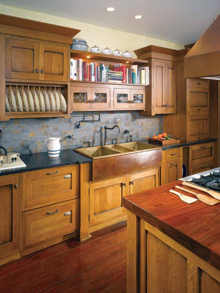 WOODWORK, INC An outstanding example of Arts and Crafts styling, this distressed quartersawn white oak kitchen