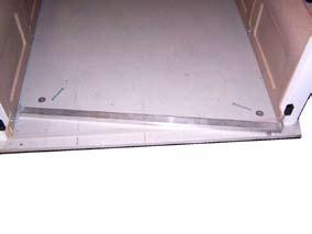 Install Threshold Install foam tape on the floorboard between the door posts.