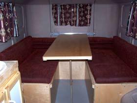 page 19 Dinette/Bed Set The dinette/bed set consists of two bench locker seats and an end self that also serve as storage bins.