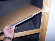 Secure the middle shelf to the side wall panel tie down