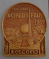 Lot # 188 - Large Gold colored Plaster Plaque with a large raised image of the Trylon and Perisphere in the center surrounded by raised fair buildings.