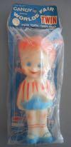 Lot # 310 - Squeeze Toy of Wendy in the original package. Wendy has blue and orange decorations. The packaging is blue, white and orange with "Candy Official World's Fair Twin" across the top.