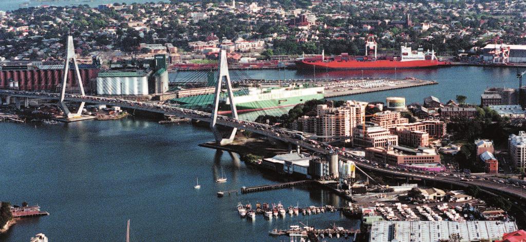 ABOVE: Aerial of the Anzac Bridge and surrounding areas, September 1999. Photo by Robert Pearce. Ferries, the light rail and new bus routes all now service the precinct.