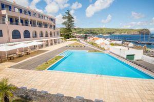 All the rooms have balconies overlooking the sea and there is a large outdoor pool.