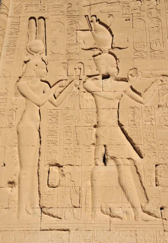 History and Conquest The rear exterior wall of the temple of Dendera carries a huge relief of the queen Cleopatra and