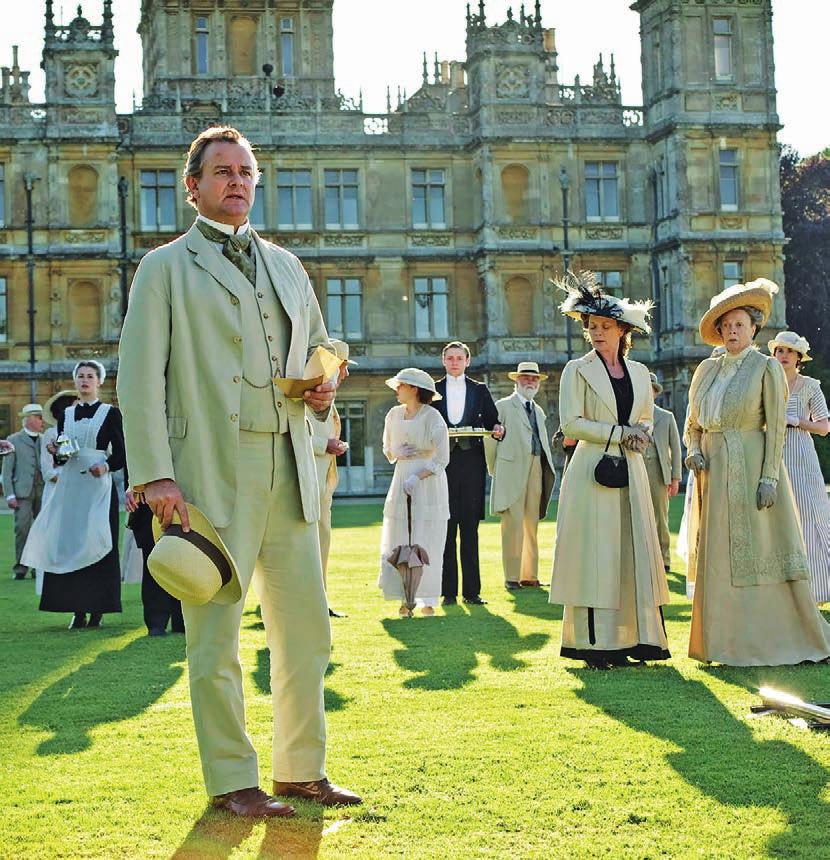 [ ULTIMATE ] Below: The Downton Abbey cast pose in front of Highclere Castle in Hampshire, where most of the television series was filmed.