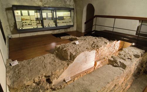 The eastern site includes a thick wall of squared stones bordering a small room plastered with a black and white grid decoration, and it dates back Wall with fresco remains (Augustan Age); in close