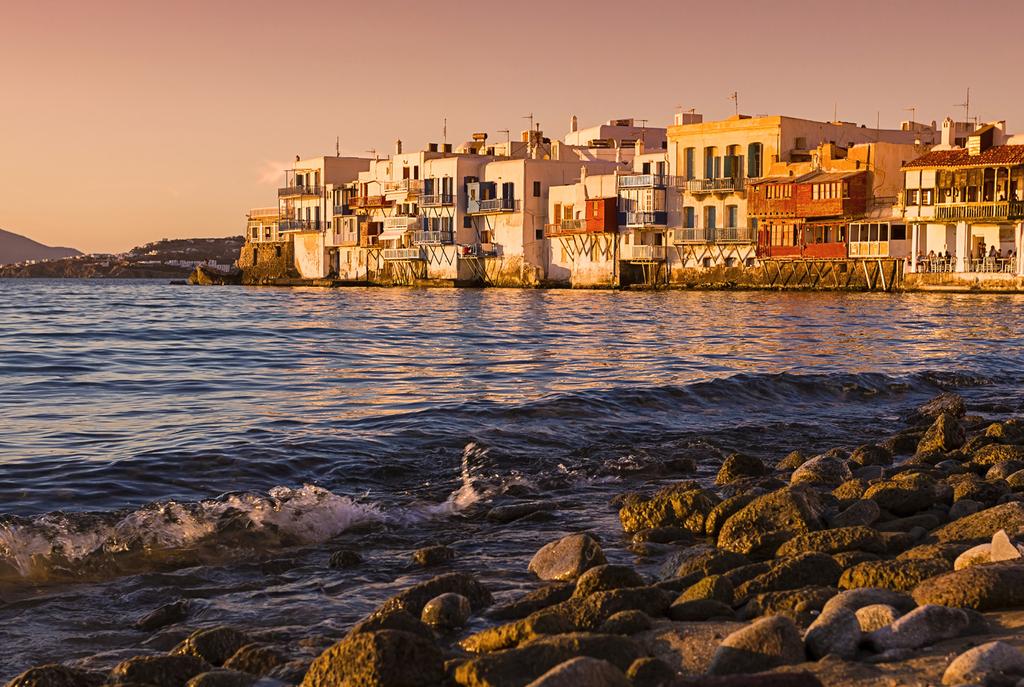 Mykonos Overview Mykonos is known for its beautiful crystal waters, its long sandy beaches and of course its nightlife Mykonos, Greece s most famous international jet set destination, is located in