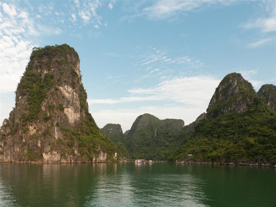 Halong Bay Click to edit Master title style Located 170 km (105 miles) east of Hanoi, 4-hour road transfer each way. Famous for scenic ocean karst topography and is a UNESCO World Heritage Site.