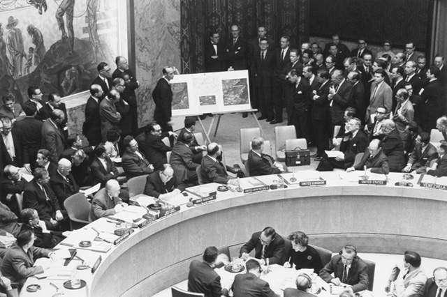 Adlai Stevenson shows aerial pictures of Cuba to the United Nations, November 1962.
