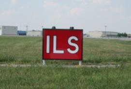 15.3.2. Instrument Landing System (ILS) Holding Position Signs have white letters on a red background.