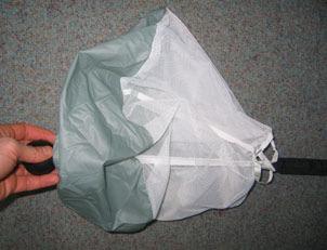 Lay down the main parachute: Lay down the finished pack job gently on the ground.