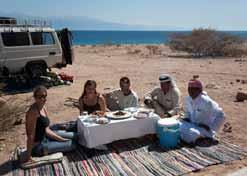 commercial tourism. The town is surrounded by natural beauty, with views of the Sinai mountains, the rich blues of the Red Sea reefs and the mountains of Saudi Arabia across the Gulf of Aqaba.