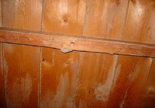 View of missing lintel (arrow) in doorway