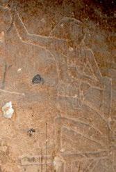 The west wall of the chamber has the image of a jackal-headed god in the south corner with a protective lion headed demon.