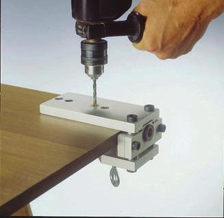 Insert 12mm Concealed Leveler into placement hole. Adjust as needed through adjustment hole.