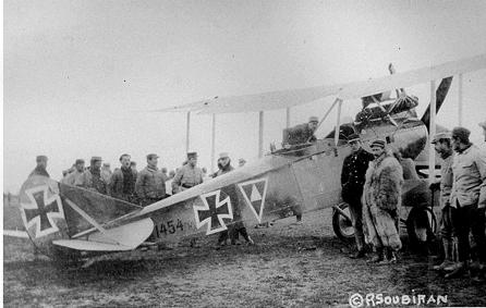 In the photo below, Allied troops surround and inspect a German Rumpler, which was