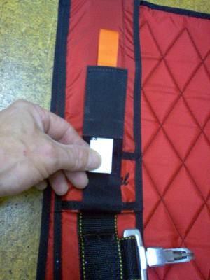 The pack data card stow pocket is located on the right main lift web under the riser cover.