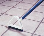 Spectrum Tile & Grout Brush with molded-in scraper is a dual purpose brush that can be held in your hand or used with