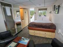 * Select cabins can accommodate a 3rd guest AAA: One queen bed, and either two chairs or one twin bed.