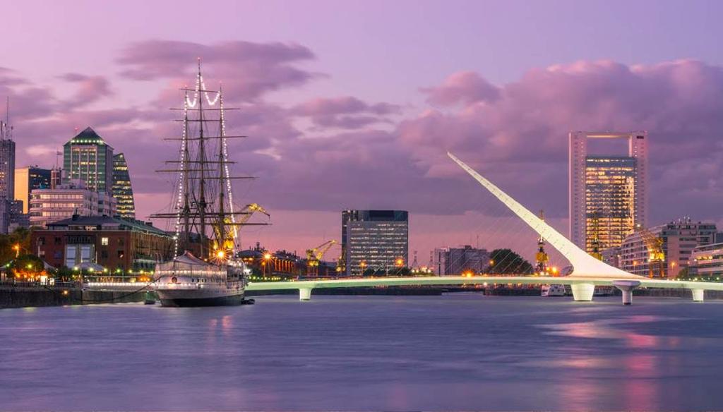 As the sun sets, admire the 19th-century shipping vessels, docks, and the Puente de la Mujer ( Woman s Bridge ) a rotating cantilever bridge meant to resemble a female tango dancer.