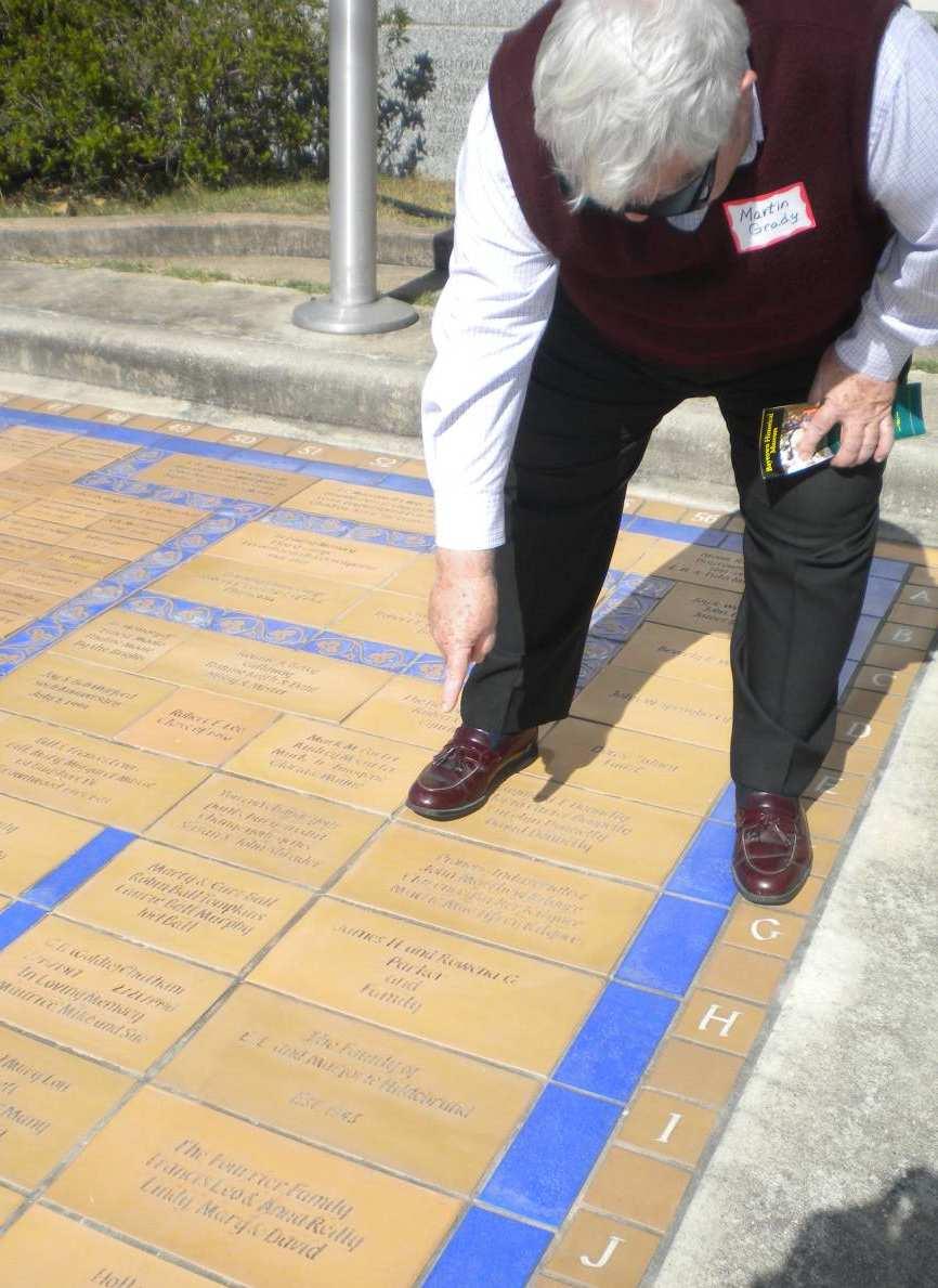 Club Member Martin Grady pointing to his sister & brother-in-law s (Rowena & James Parker) commemorative brick at the Baytown Historical Museum (1 of 2).