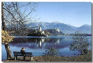 It is often referred to as the pearl of the Alpine region owing to its emerald-green lake, a church on the island in the middle of the lake and a medieval castle from the 11th century, perched on a