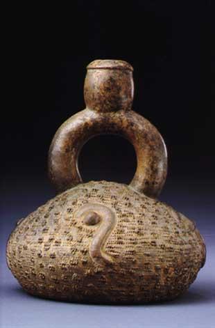 Typical of Chavin ceramics are flat-bottomed stirrup spout vessels, rows of recurring ornamental motifs, carved.