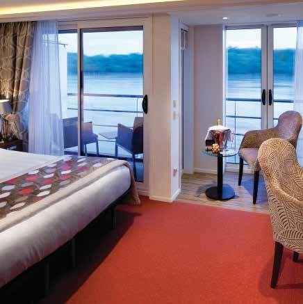 STATEROOM FEATURES: v River views in all accommodations with revolutionary twin balconies on the Violin and Cello decks v Deluxe hotel-style bedding with high-thread count linens, plush pillows and