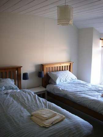 furnished with a double bed and wardrobe.
