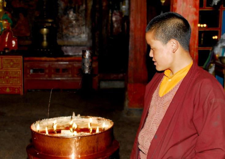 Monk meditating with aid of Yak butter
